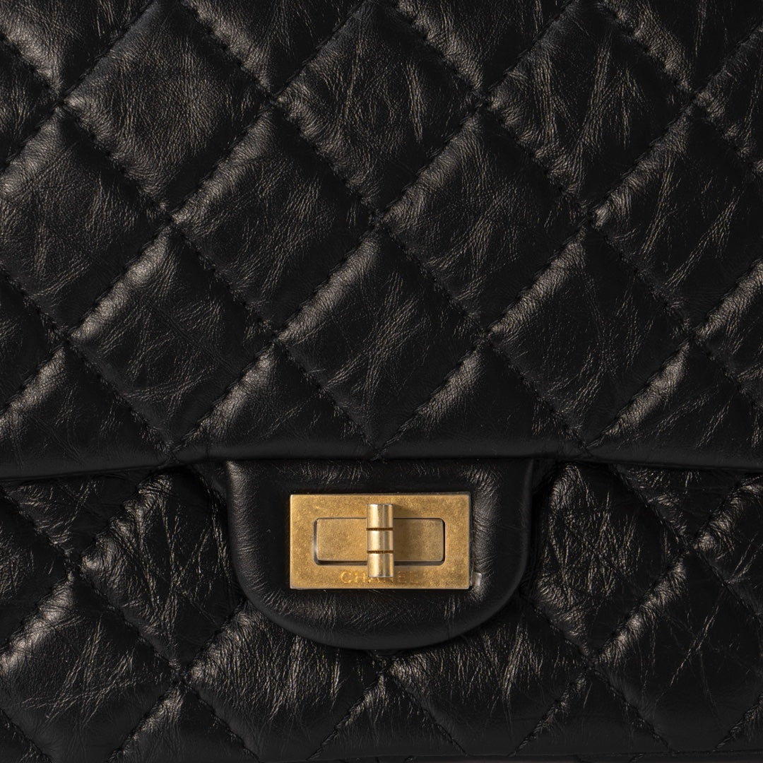 Chanel 2.55 Handbag in Black Aged Calfskin with Gold Tone Metal Hardware