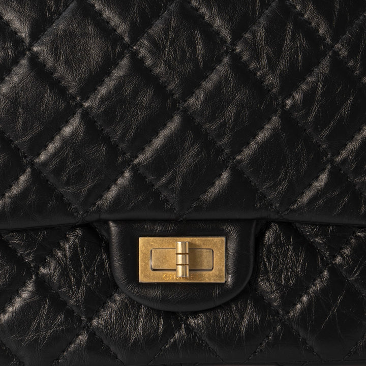 Chanel 2.55 Handbag in Black Aged Calfskin with Gold Tone Metal Hardware