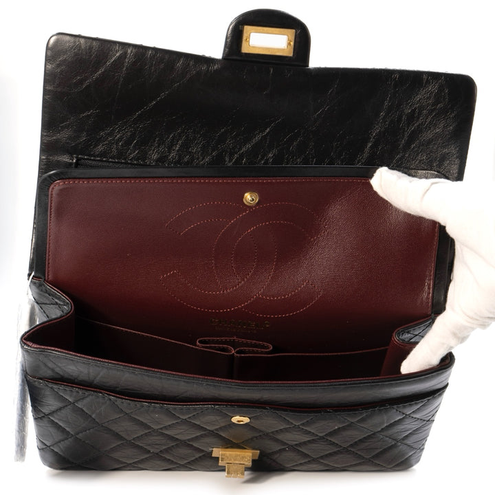 Chanel 2.55 Handbag in Black Aged Calfskin with Gold Tone Metal Hardware