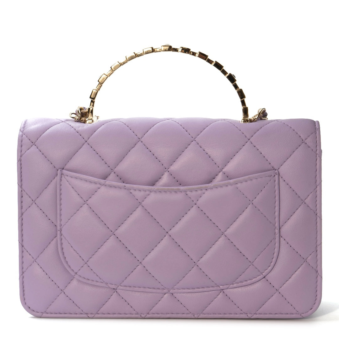 Chanel Mini Flap Bag With Handle in purple lambskin leather with champagne gold hardware