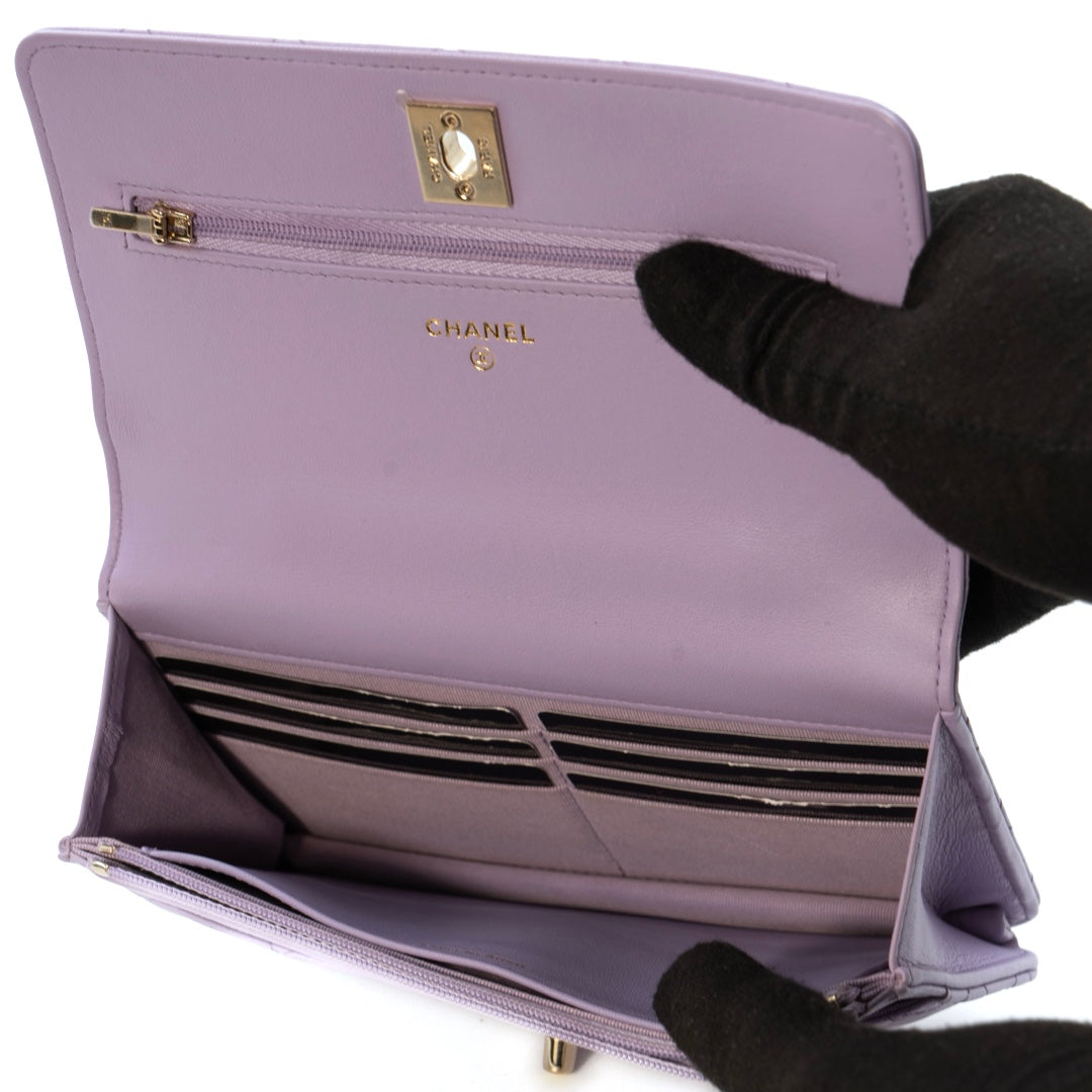 Chanel Mini Flap Bag With Handle in purple lambskin leather with champagne gold hardware