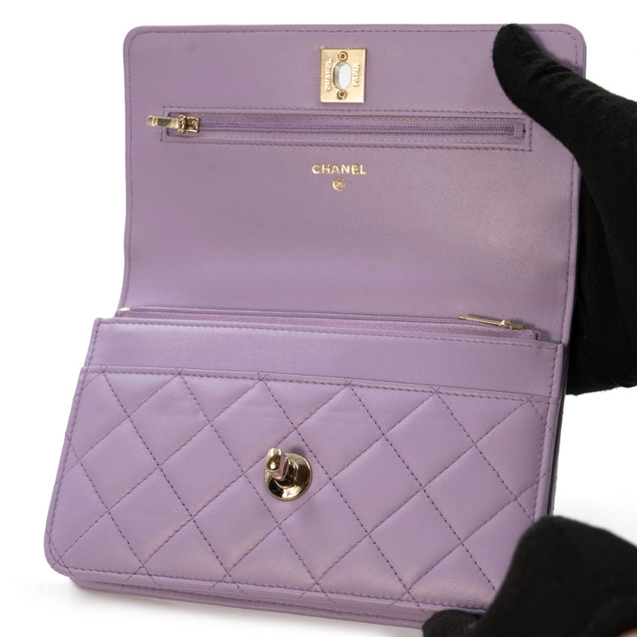 Chanel Mini Flap Bag With Handle in purple lambskin leather with champagne gold hardware