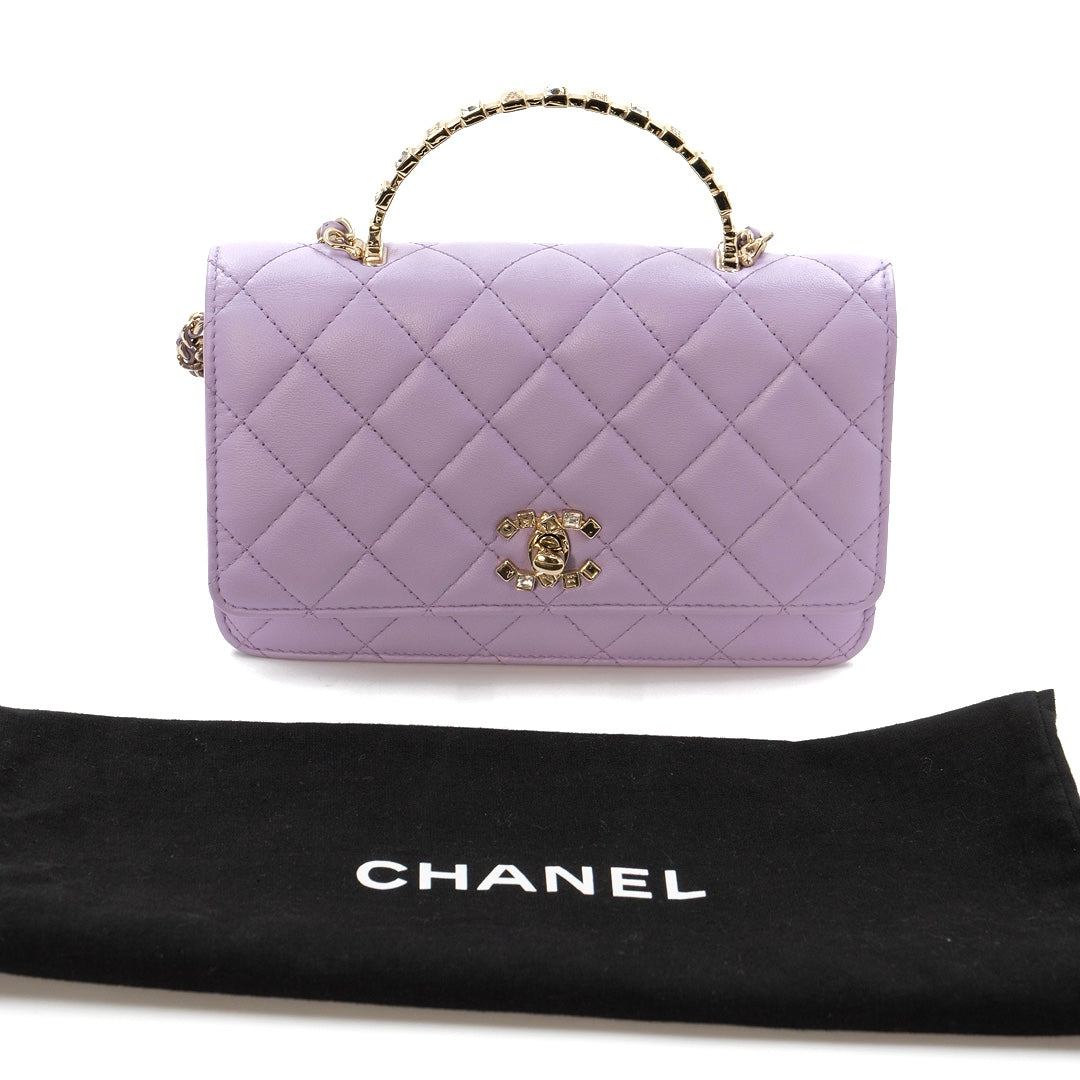 Chanel Mini Flap Bag With Handle in purple lambskin leather with champagne gold hardware