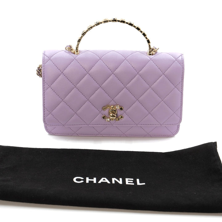 Chanel Mini Flap Bag With Handle in purple lambskin leather with champagne gold hardware