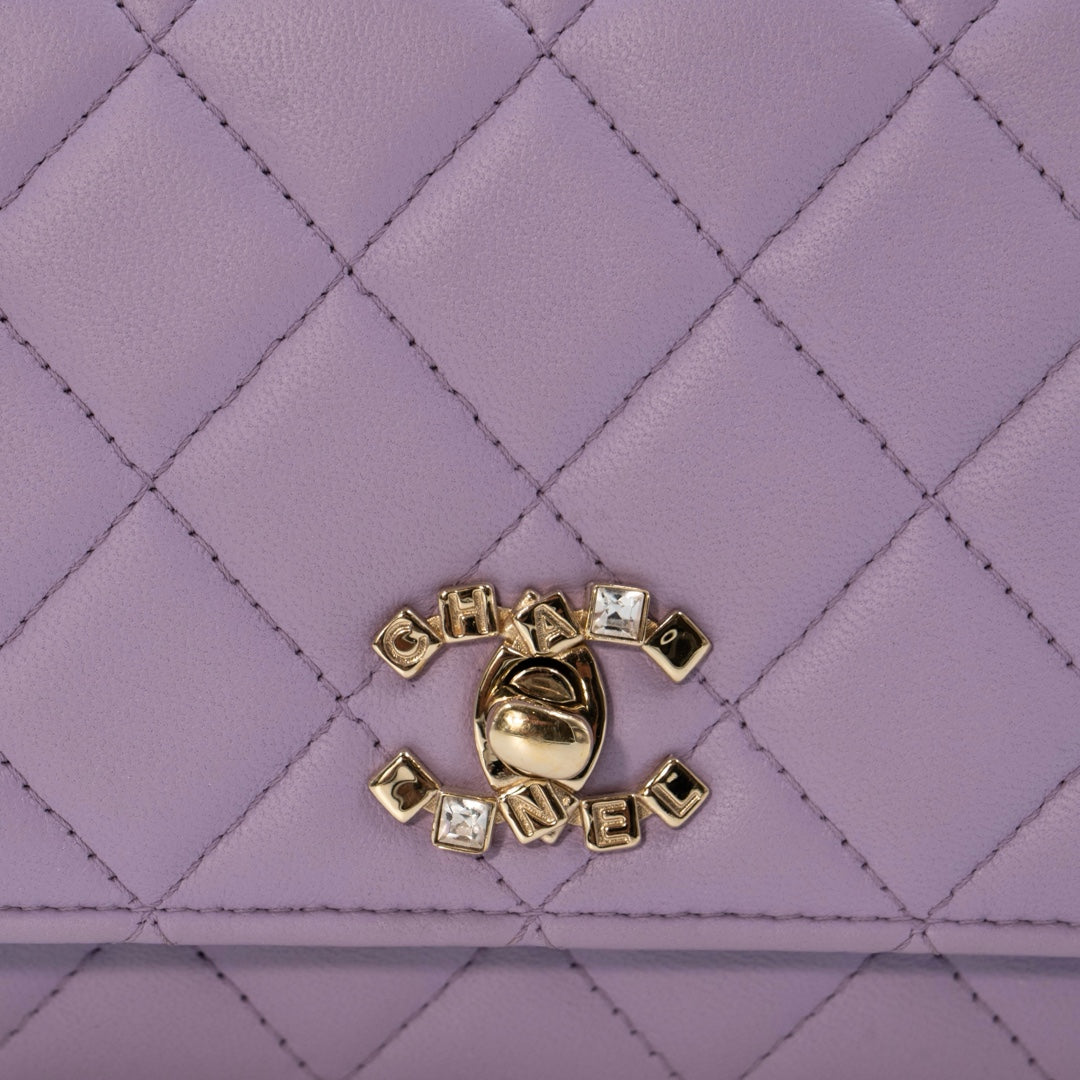 Chanel Mini Flap Bag With Handle in purple lambskin leather with champagne gold hardware