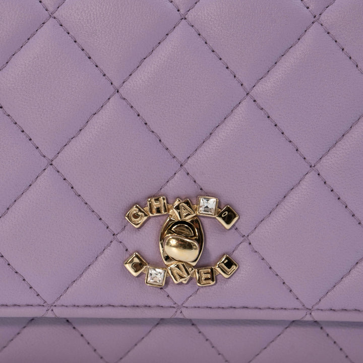 Chanel Mini Flap Bag With Handle in purple lambskin leather with champagne gold hardware