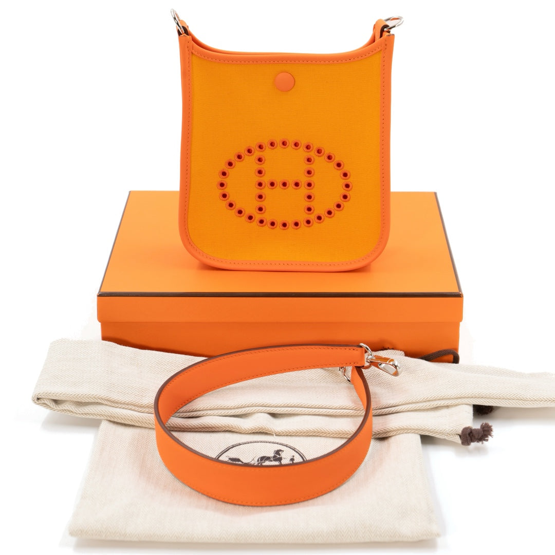 Hermès Neo Evelyne TPM Bag in Feu & Jaune d’Or Toile Officier with Swift Leather Trim and Palladium Hardware