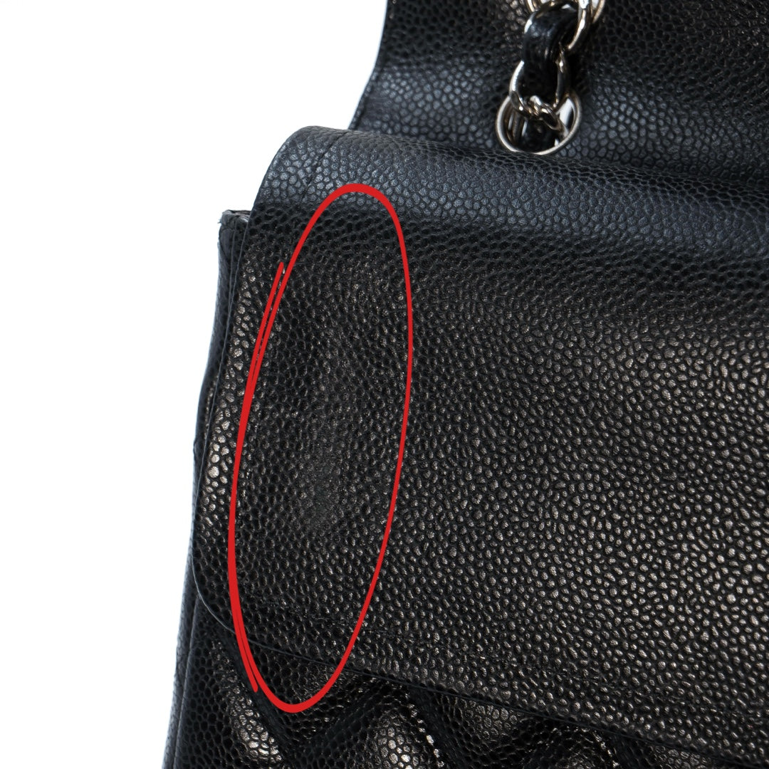 Chanel Black Maxi Classic Caviar Double Flap bag with silver-tone hardware