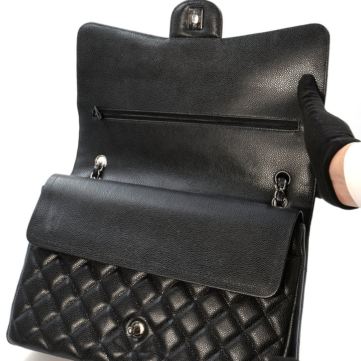 Chanel Black Maxi Classic Caviar Double Flap bag with silver-tone hardware