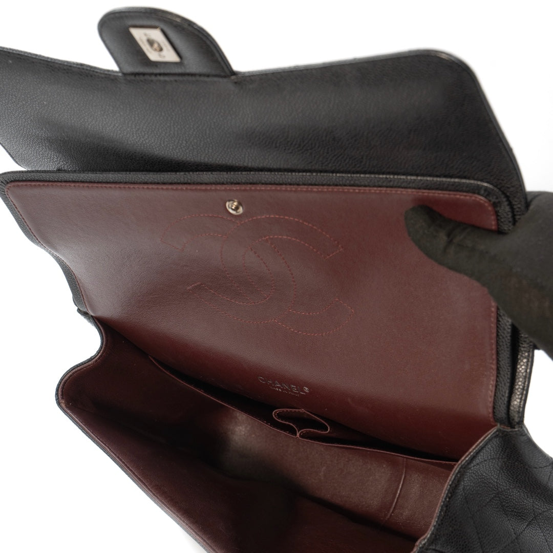 Chanel Black Maxi Classic Caviar Double Flap bag with silver-tone hardware