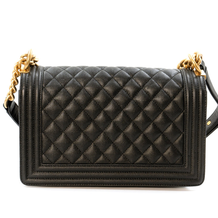 Chanel Boy Medium flap bag in black quilted caviar leather with gold tone hardware