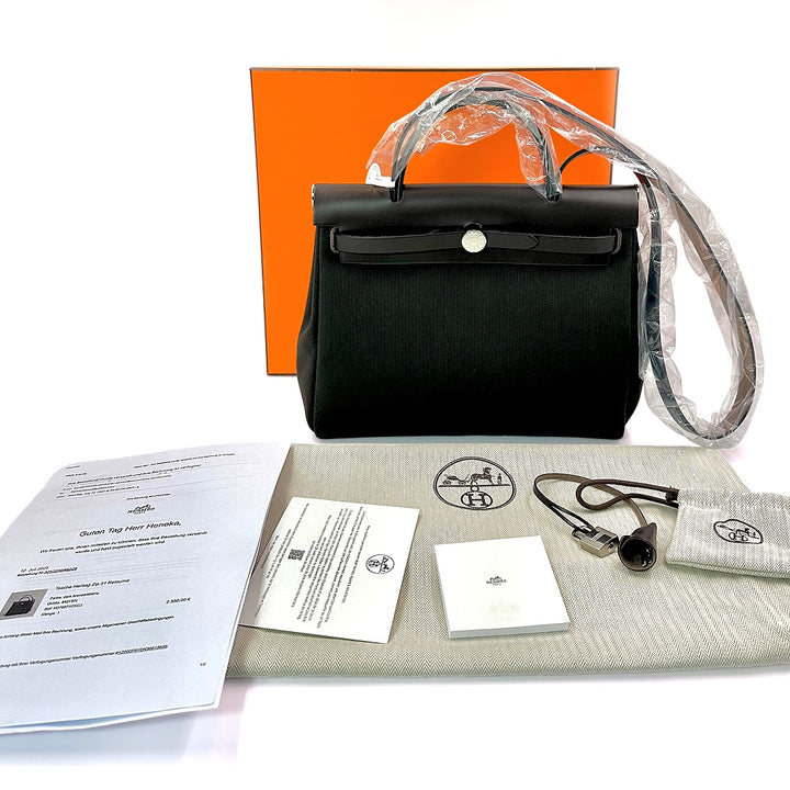 Hermès Herbag Zip 31 Retourne Bag in Dark Bronze Canvas with Ebene Leather Trim - Gemaee  UAE