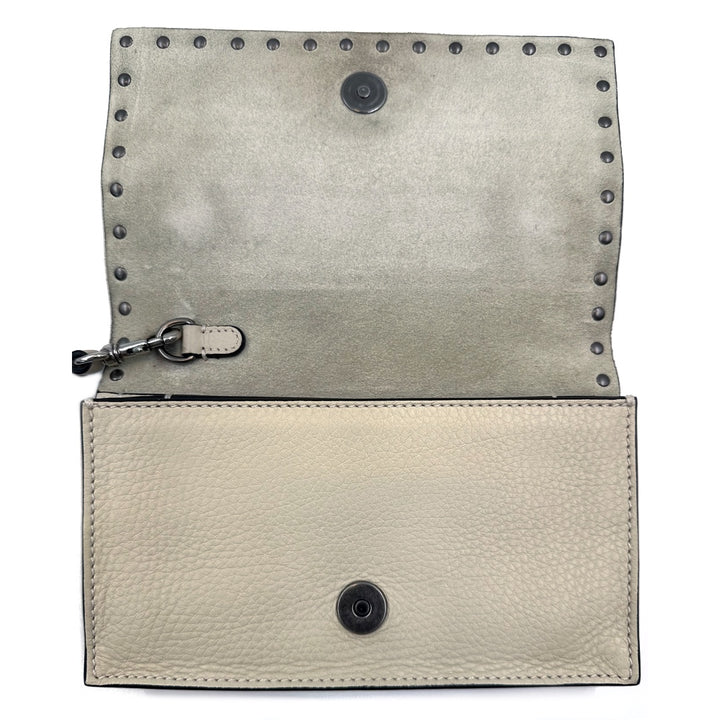 Valentino Garavani Rockstud Rolling Clutch in Beige Leather with Turquoise Cabochons and Antique Silver Studs - Gemaee  UAE