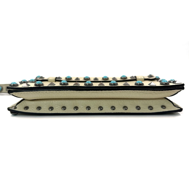 Valentino Garavani Rockstud Rolling Clutch in Beige Leather with Turquoise Cabochons and Antique Silver Studs - Gemaee  UAE