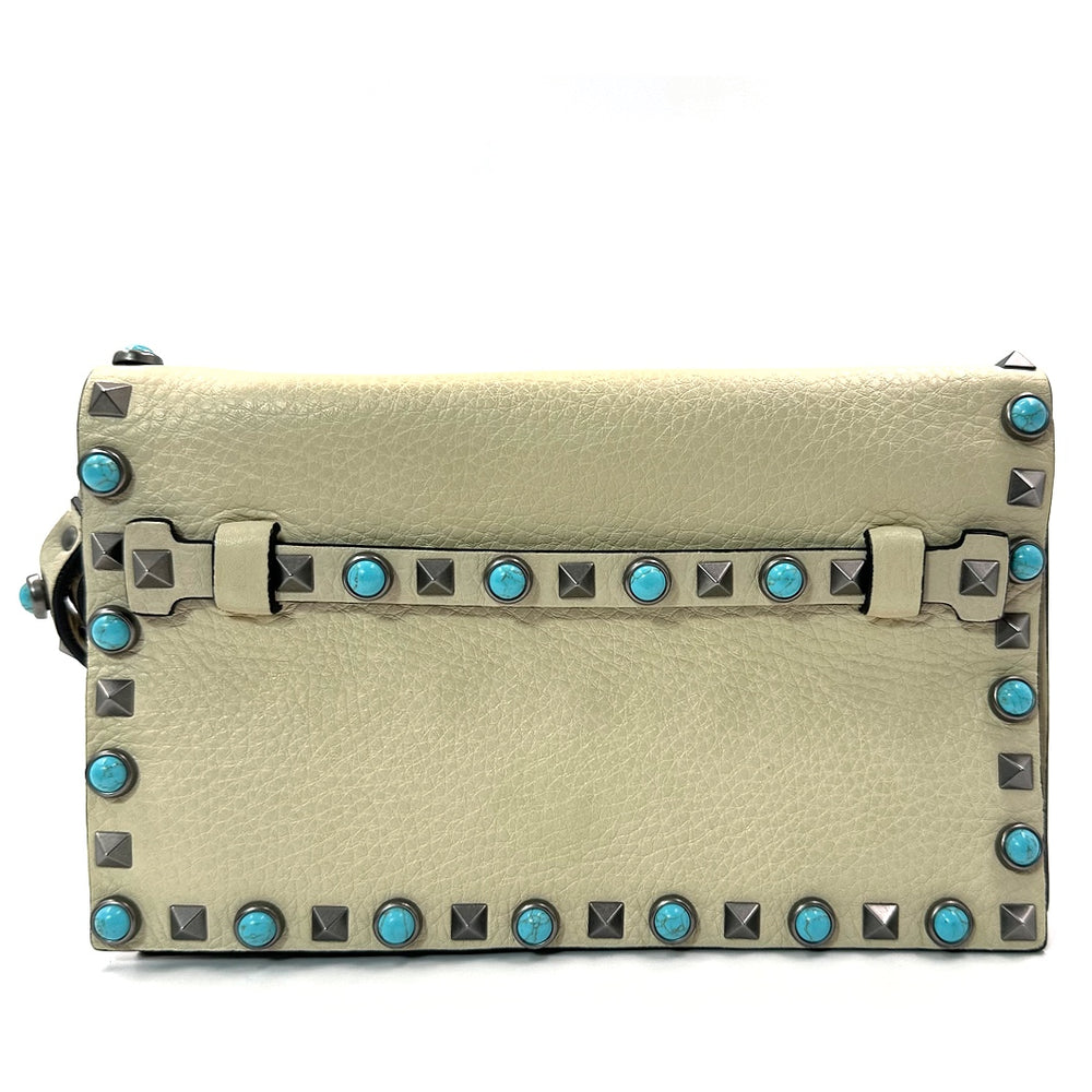 Valentino Garavani Rockstud Rolling Clutch in Beige Leather with Turquoise Cabochons and Antique Silver Studs - Gemaee  UAE