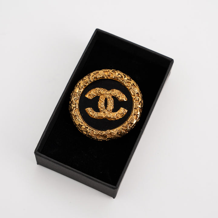 Chanel Coco Mark Lava Brooch in Gold Tone Metal & Black Resin