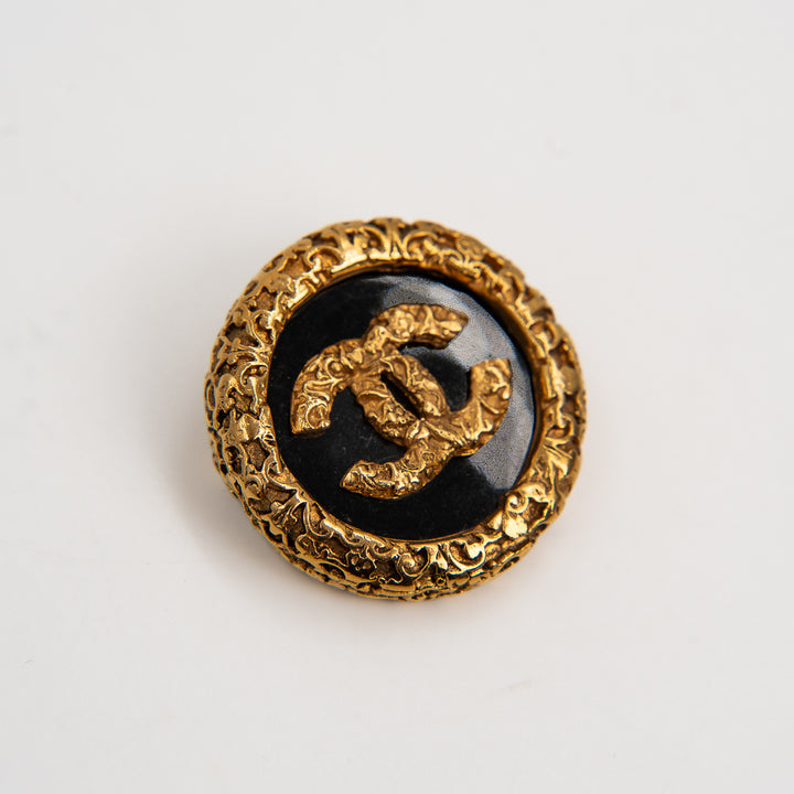 Chanel Coco Mark Lava Brooch in Gold Tone Metal & Black Resin