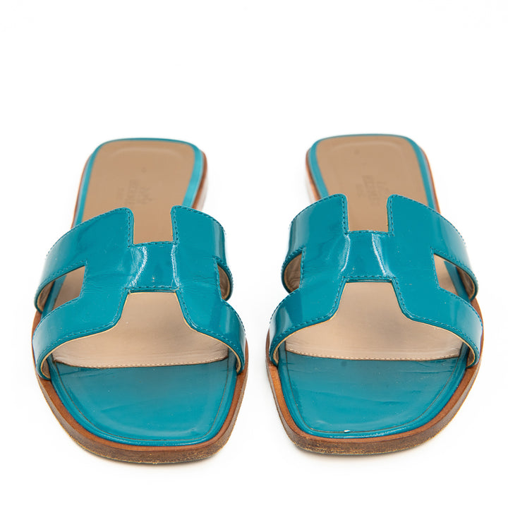 Hermès Oran Flat Slides in Teal Patent Patent Leather