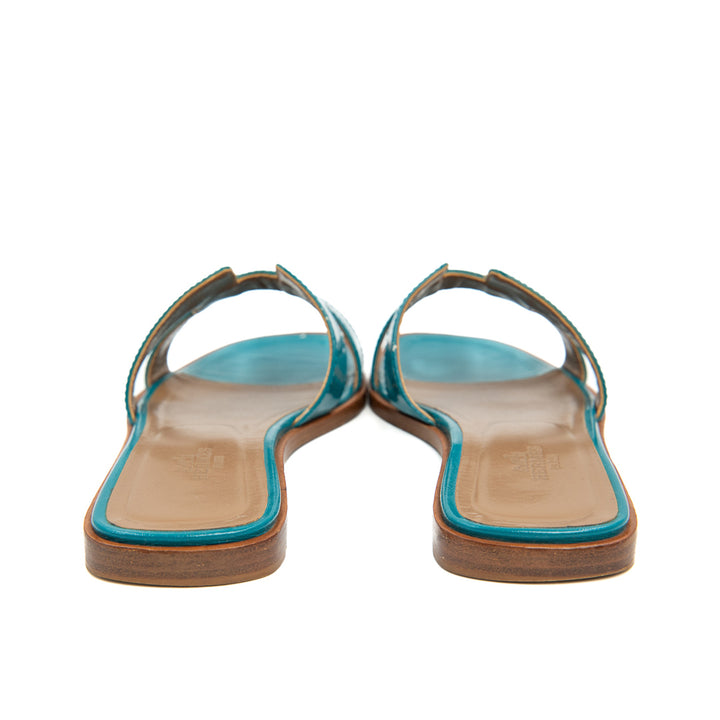 Hermès Oran Flat Slides in Teal Patent Patent Leather
