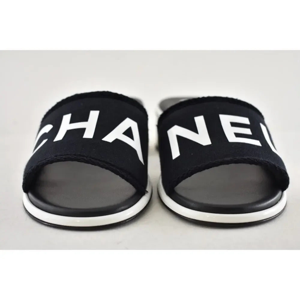 Chanel 24C Black & White CHA NEL Letter Logo Mule Slide Block Heel Sandals
