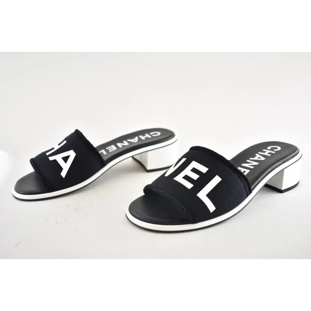 Chanel 24C Black & White CHA NEL Letter Logo Mule Slide Block Heel Sandals