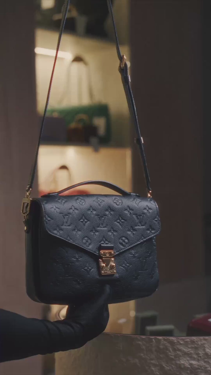 Louis Vuitton Pochette Metis bag in black Monogram Empreinte leather with gold-tone hardware